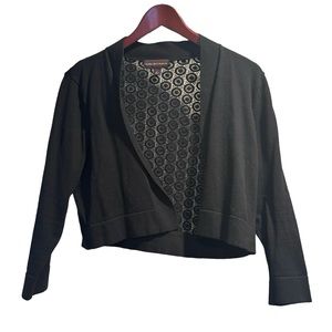 Short cardigan with embellished back.